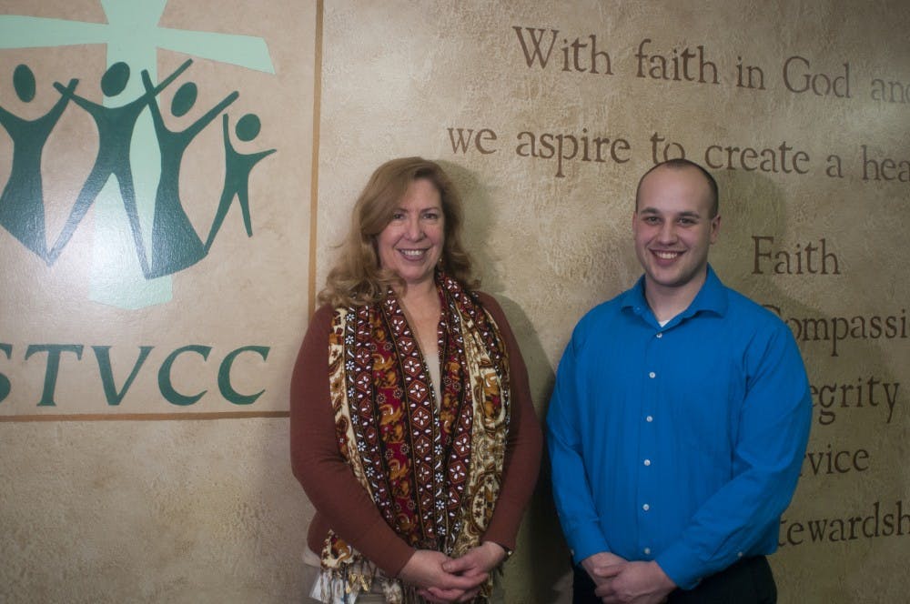 Director of refugee services Judi Harris, left, and associate director of community services John Karasinski pose for a portrait on Feb. 3, 2016 at the Refuge Development Center  on 2800 West Willow St. in Lansing.