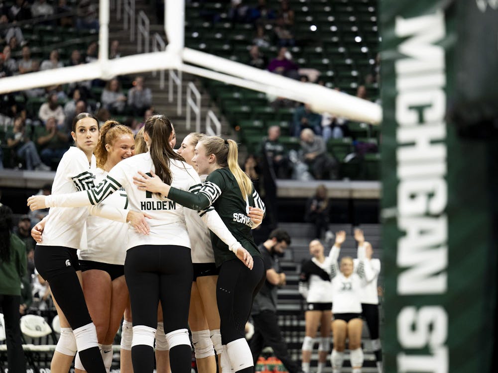 <p>Spartan players celebrate on the court as they chip away at USC’s lead during the volleyball match at the Breslin Center on Wednesday, Nov. 26, 2025.</p>