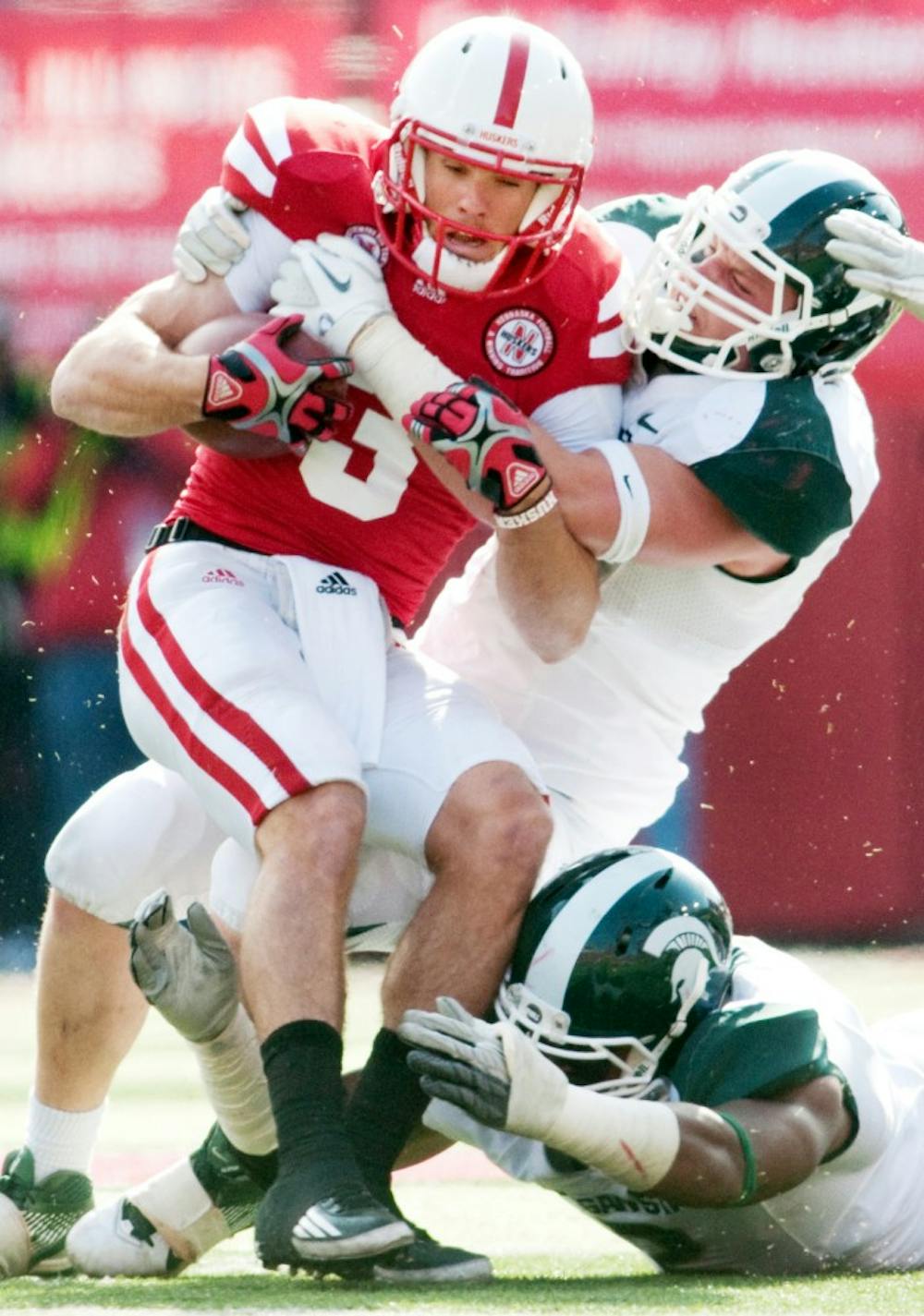 Sophomore linebacker Max Bullough tackles Nebraska quarterback Taylor Martinez on a run. The Cornhuskers ran for 190 yards and defeated the Spartans, 24-3, on Saturday afternoon at Memorial Stadium in Lincoln, Neb. Josh Radtke/The State News