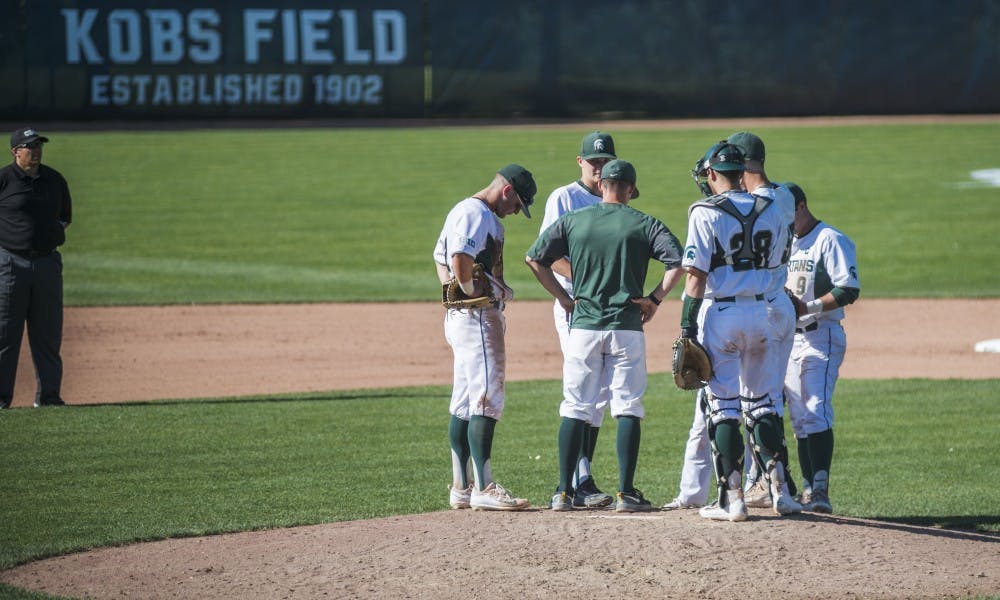 The Spartans gather to talk during the the game against the University of Michigan on May 18, 2017 at McLane Baseball Stadium at Kobs Field. The Spartans defeated the Wolverines 6-1.