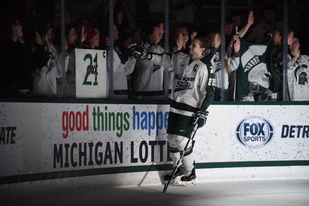 Senior forward 	Joe Cox (21) skates one last time around the rink after the game against Penn State on Feb. 25, 2017 at Munn Ice Arena. The Spartans were defeated by the Nittany Lions, 4-1