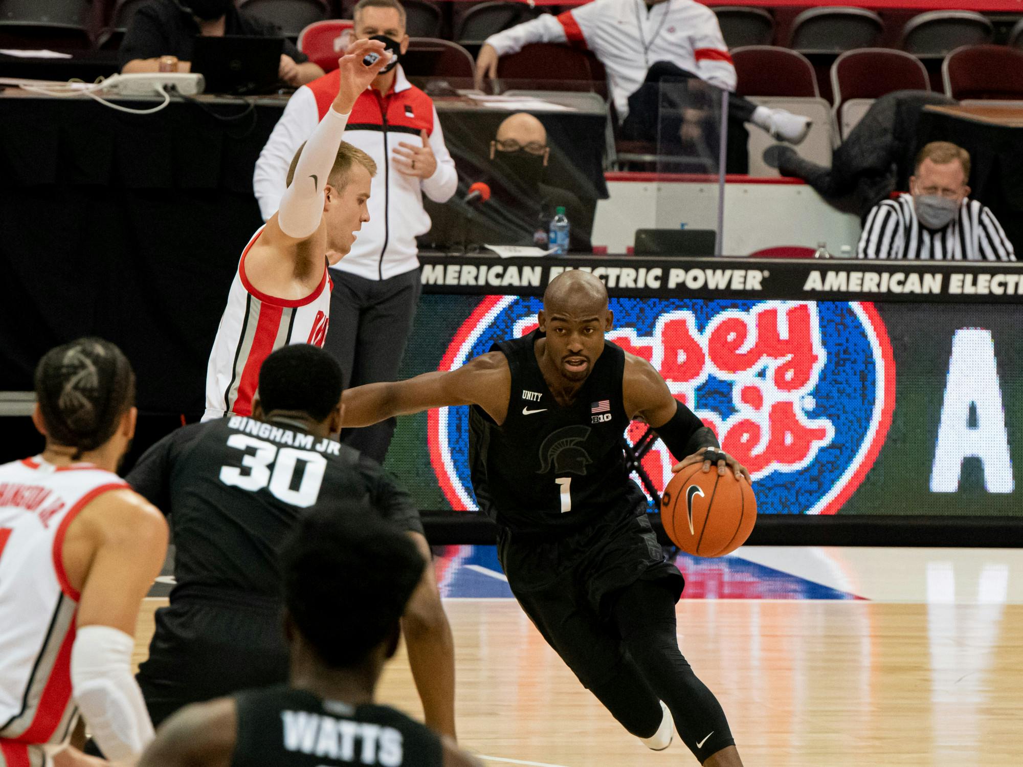 <p>Joshua Langford communicates with his teammates Rocket Watts and junior forward Marcus Bingham Jr. (30) during the first half of the game. The Buckeyes swept the Spartans, 79-62, at OSU&#x27;s Schottenstein Center on Jan. 31, 2021.</p>