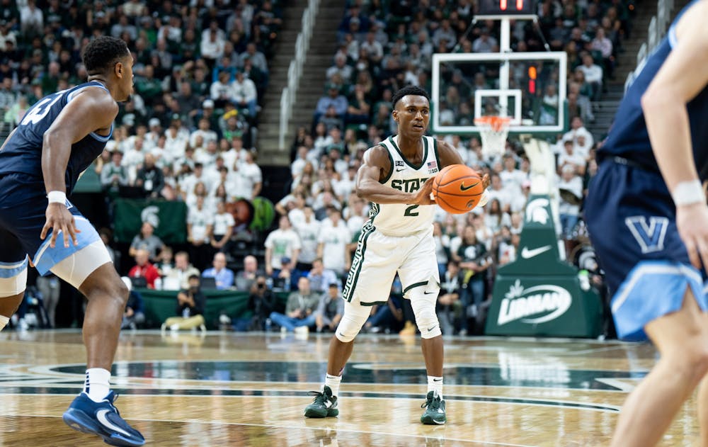 Senior guard (2) passes the ball to his teammate during a game against Villanova at the Breslin Center on Nov. 18, 2022. The Spartans defeated the Wildcats 73-71. 