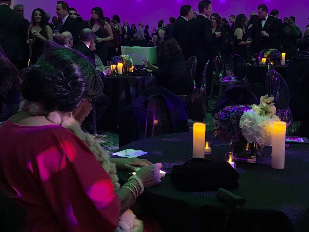 <p>A supporter sits at a table at Gov. Gretchen Whitmer's inaugural celebration at the Cobo Center in Detroit Jan. 1, 208.&nbsp;</p>