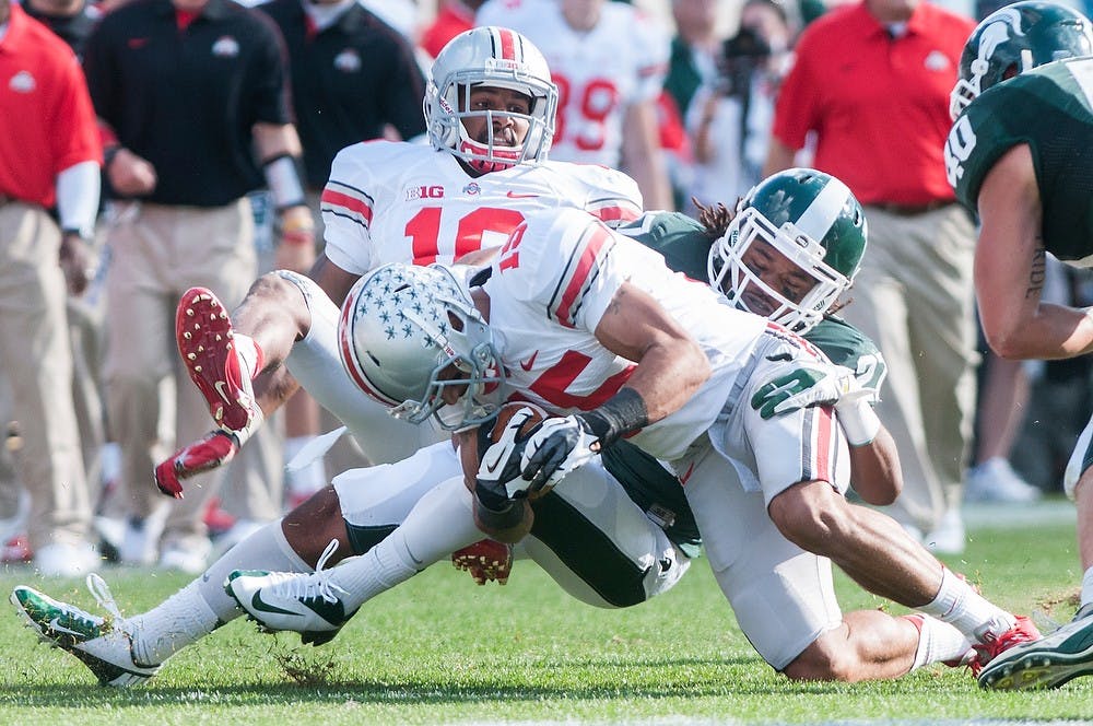 	<p>Ohio State wide receiver Devin Smith is tackled by sophomore safety Kurtis Drummond during a game on Saturday, Sept. 29, 2012 at Spartan Stadium. The Spartans lost against the Buckeyes 17-16. Julia Nagy/The State News</p>