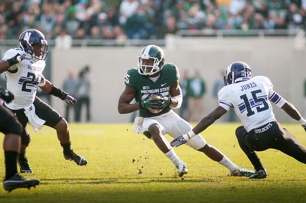 <p>Sophomore wide receiver Keith Mumphery dodges cornerback Daniel Jones on Saturday, Nov. 17, 2012, at Spartan Stadium. Mumphery finished the game with 79 receiving yards in the Spartans’ 23-20 loss to Northwestern. James Ristau/The State News</p>