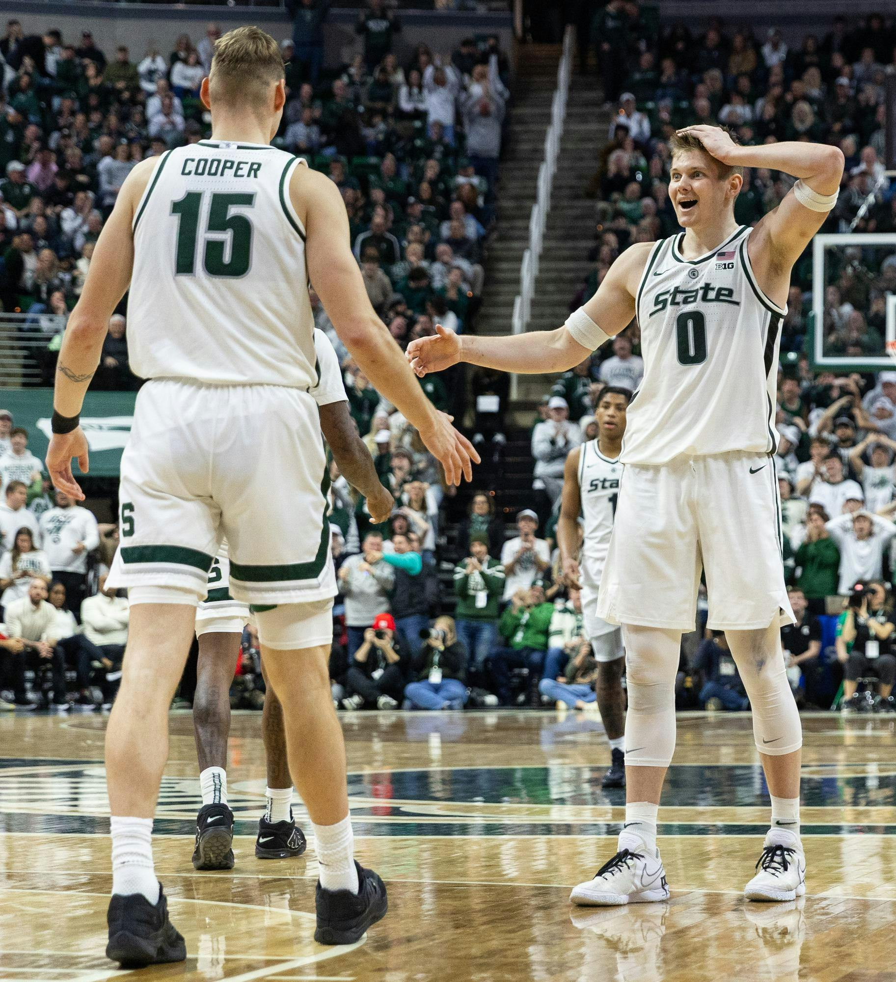 MSU Sr. F, Jaxon Kohler (0), and MSU Sr. C, Carson Cooper (15), are in shock after MSU Jr. F, Coen Carr (55), dunks the ball over a defender in the Breslin Center in East Lansing, MI on Jan. 24, 2026.