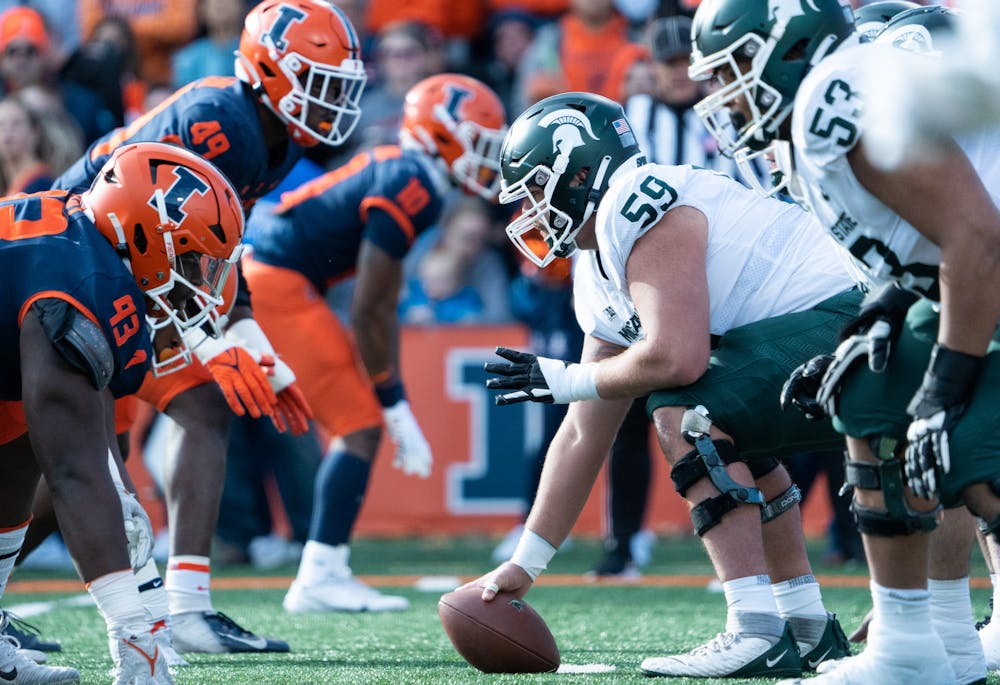 <p>Senior center Nick Samac (59) hikes the ball during the first half of a game against Illinois at Memorial Stadium on Nov. 5, 2022. Spartans beat the Fighting Illini with a score of 23-15. </p>