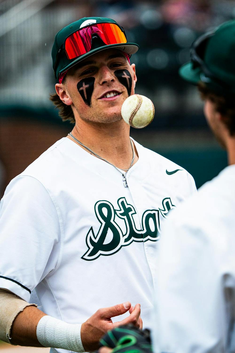 <p>MSU junior outfielder JT Sokolove (2) tosses a baseball while conversing with teammates during a game at McLane Stadium on April 13, 2025.</p>