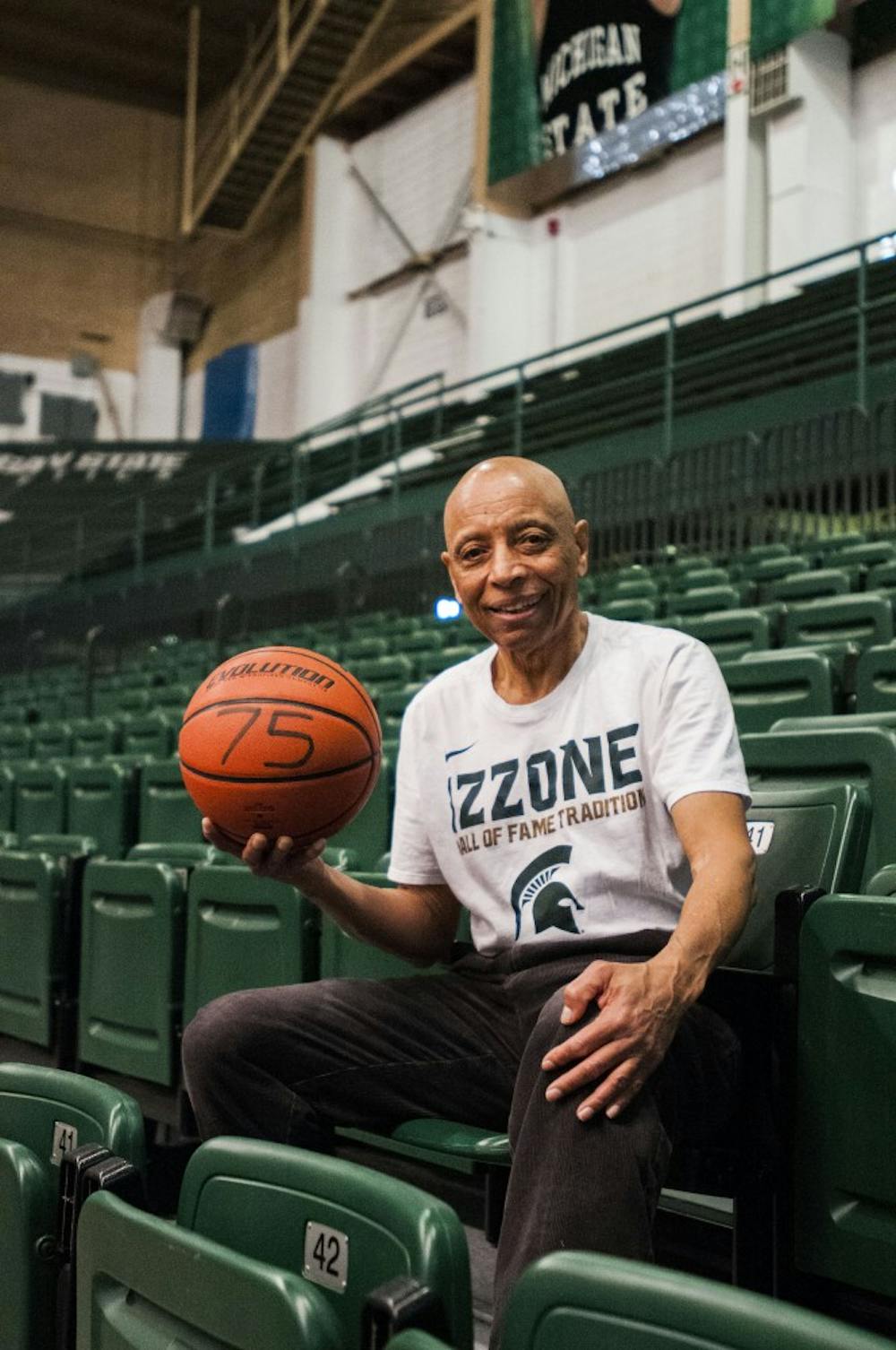 East Lansing resident James Cummings, 75, shows off his basketball marked with his age, that he uses to defeat any and all challengers in the childhood favorite game of H.O.R.S.E. on Jan. 12, 2018 at Jenison Fieldhouse. "I just love the game of H.O.R.S.E., I think it should be an Olympic sport," James said. (C.J. Weiss | The State News)
