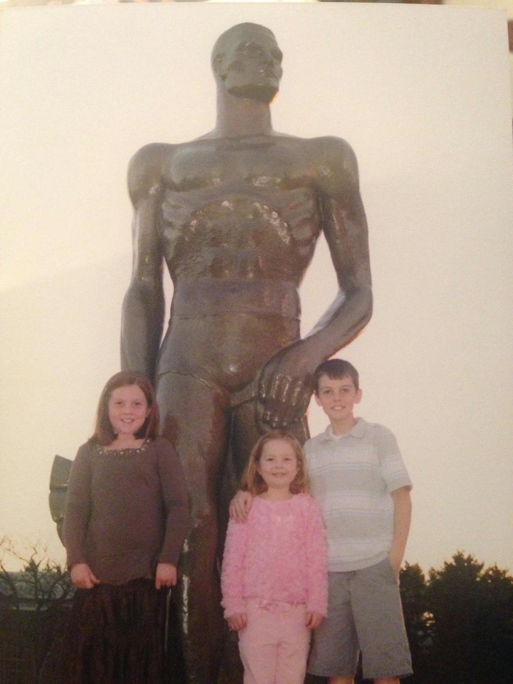Education junior Kelly Burzych stands in between her siblings Mary Kay and Jay for a photo at the Spartan Statue on a visit in 2006. Burzych has been a local to the Greater Lansing area her entire life, and now goes to Michigan State University.