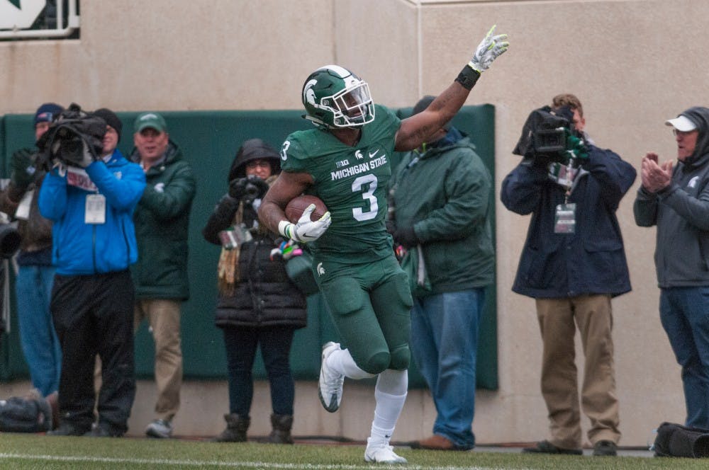 Sophomore running back L.J Scott (3) celebrates after scoring the first touchdown during the game against Ohio State on Nov. 19, 2016 at Spartan Stadium. The Spartans were defeated by the Buckeyes, 17-16. 
