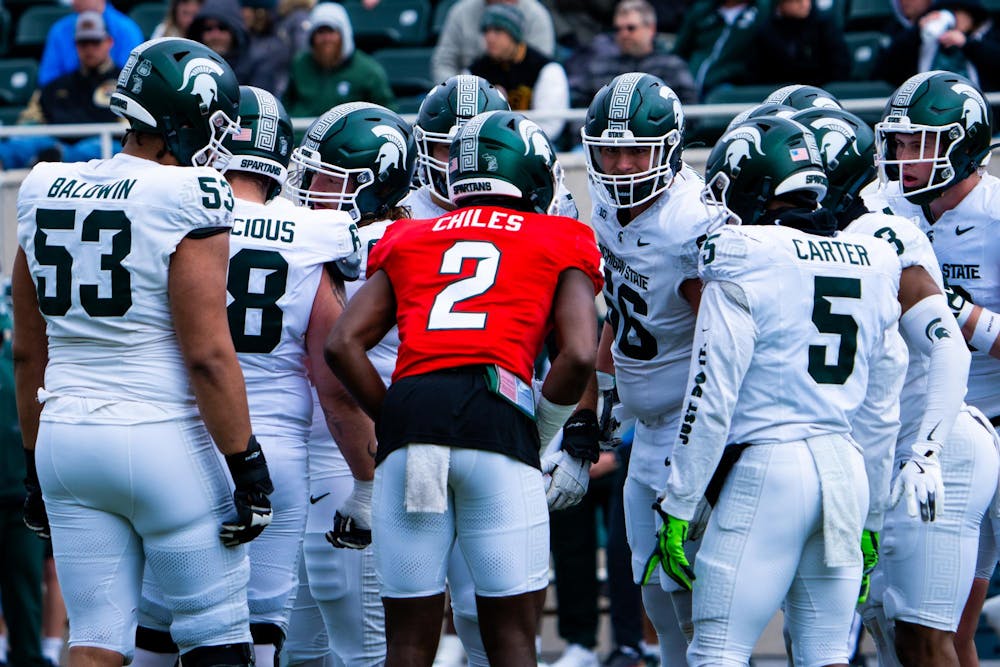<p>MSU’s offense huddles up to discuss its next play during MSU football’s 2024 Spring Showcase on April 20, 2024.</p>