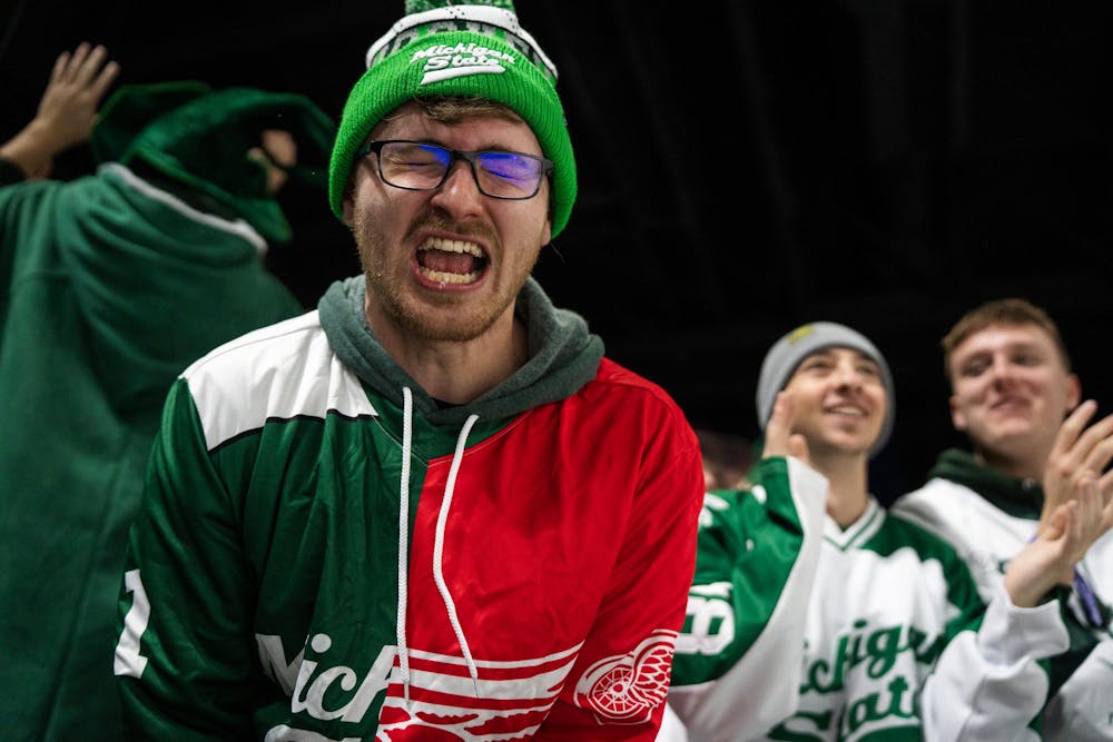 Michigan State hockey fans cheer as their team takes the lead against University of Notre Dame at Munn Ice Arena in East Lansing, Michigan, on Friday, Feb. 20, 2026.
