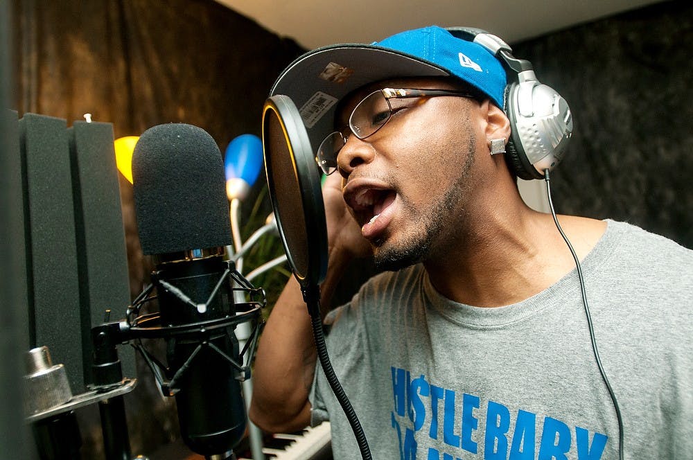	<p>Lansing resident Eric Ware raps his new album &#8220;No More Excuses II&#8221; on July 17, 2013, at Studio 707, 2722 E. Michigan Ave. Ware has been professionally rapping since 2001. Weston Brooks/The State News</p>