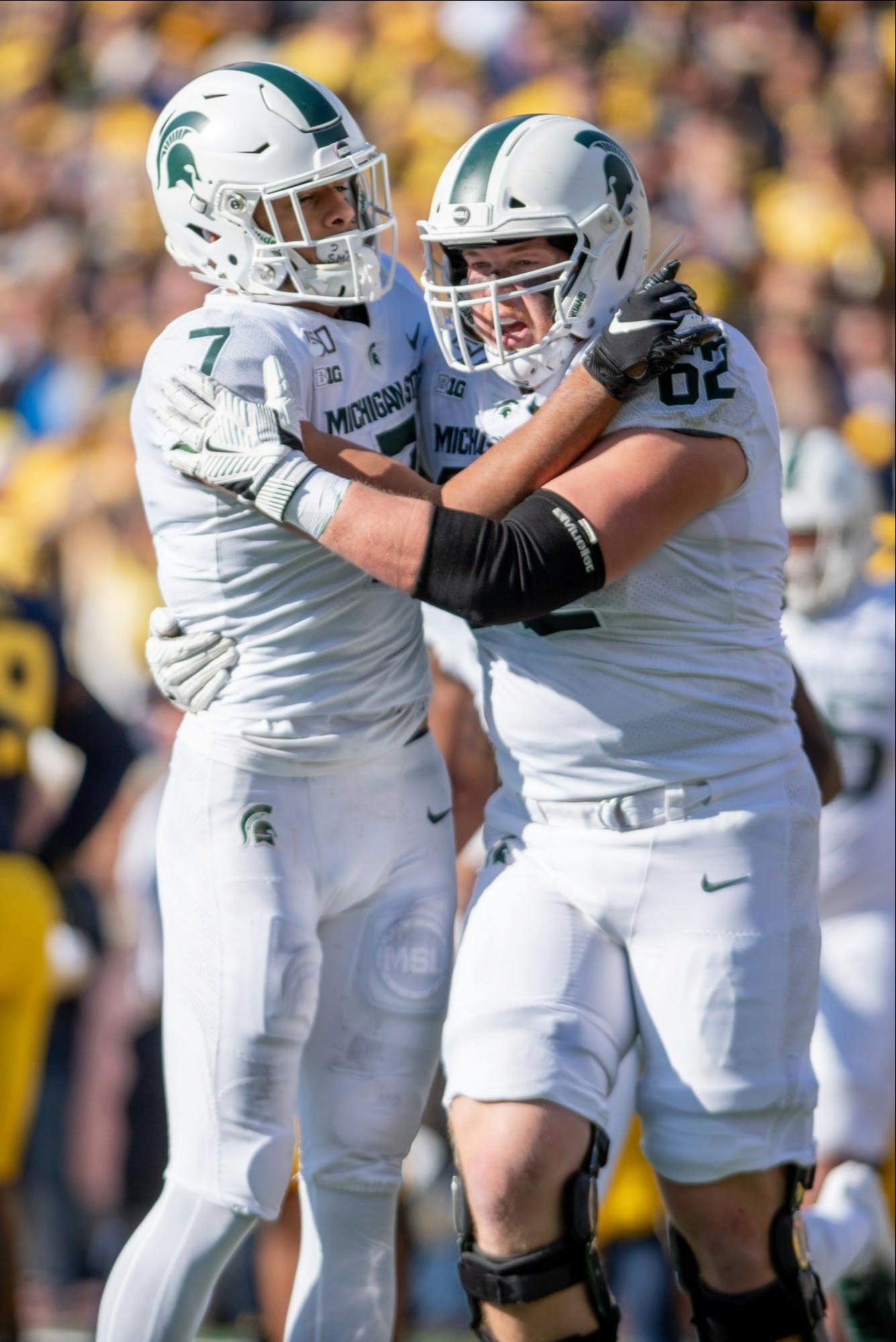 <p>Then-junior wide receiver Cody White (7) celebrates with then-junior offensive lineman Luke Campbell (62) during the game against Michigan Nov. 16, 2019 at Michigan Stadium. The Spartans fell to the Wolverines, 44-10.</p>