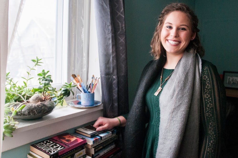 Education senior Meghan Hurley poses for a portrait on March 2, 2017 at her home at 711 W. Grand River, East Lansing. Hurley will be giving a TEDxMSU talk using spoken word on April 5, 2017 at Wharton Center. She intends to discuss how words are instrumental in the development of a human being using her own hardships. "It's a very dense, dark thing; but I am not. It's balancing how I've grown from some tough experiences and also not letting those impact me in a way that many (people) often would assume they would," Hurley said. 