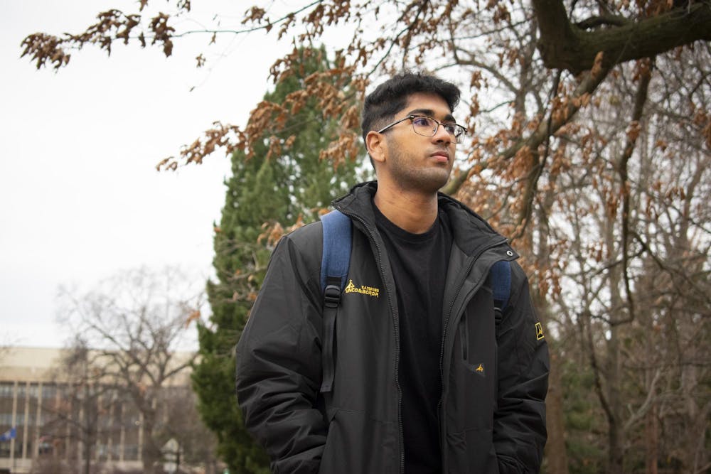 Freshman Joshua DSouza walks around central campus on Dec. 11, 2023. During winter break, DSouza plans to stay in the dorm and go to the gym. 