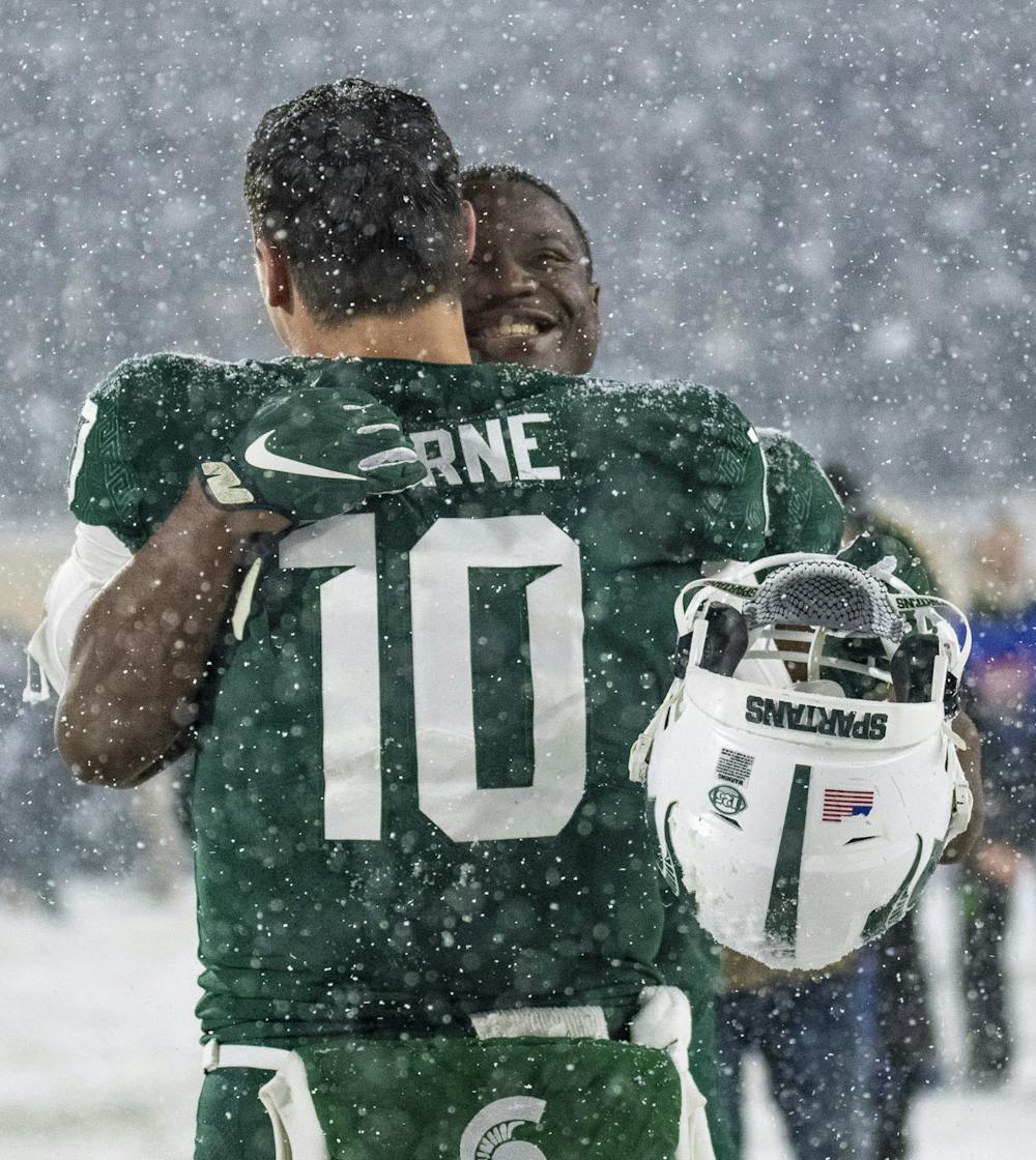 <p>Walker (9) and Thorne (10) celebrate the win against Penn State at Spartan Stadium on Saturday, Nov. 27, 2021. </p>