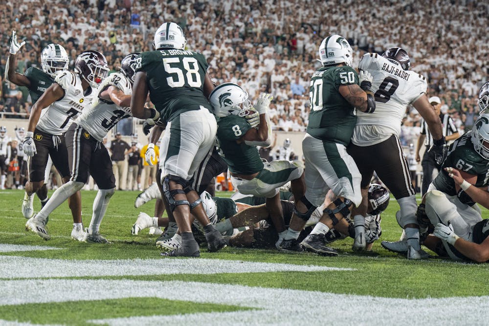 <p>Redshirt sophomore running back Jalen Berger, 8, pushes into the end zone during Michigan State’s home opener against Western Michigan at Spartan Stadium on Sept. 2, 2022. The Spartans ultimately beat the Broncos, 35-13.</p>