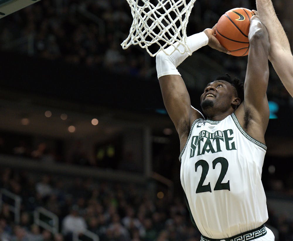 <p>Spartan center Mady Sissoko dunks the ball into the basket during the game versus Northwestern on Dec. 4, 2022.﻿</p>
