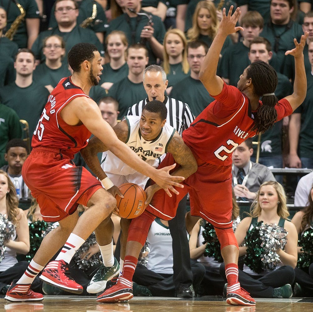 	<p>Senior guard Keith Appling struggles past Nebraska forward Walter Pitchford, left, and forward David Rivers on Feb. 16, 2014, at Breslin Center. The Spartans lost to the Cornhuskers, 60-51. Julia Nagy/The State News</p>