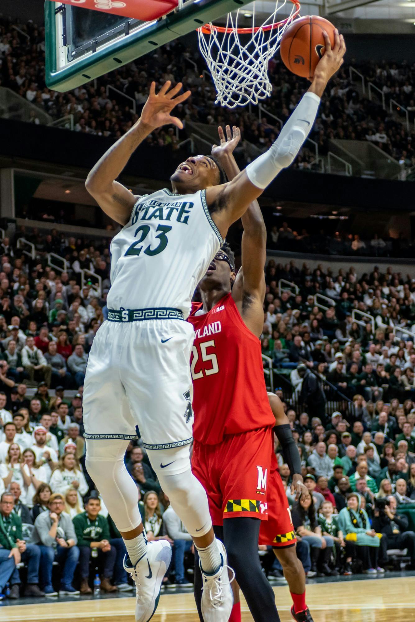 <p>Then-junior forward Xavier Tillman (23) shoots a layup while Maryland’s Jalen Smith defends him (25). The Spartans fell to the Terrapins, 60-67, at the Breslin Student Events Center on Feb. 15, 2020. </p>