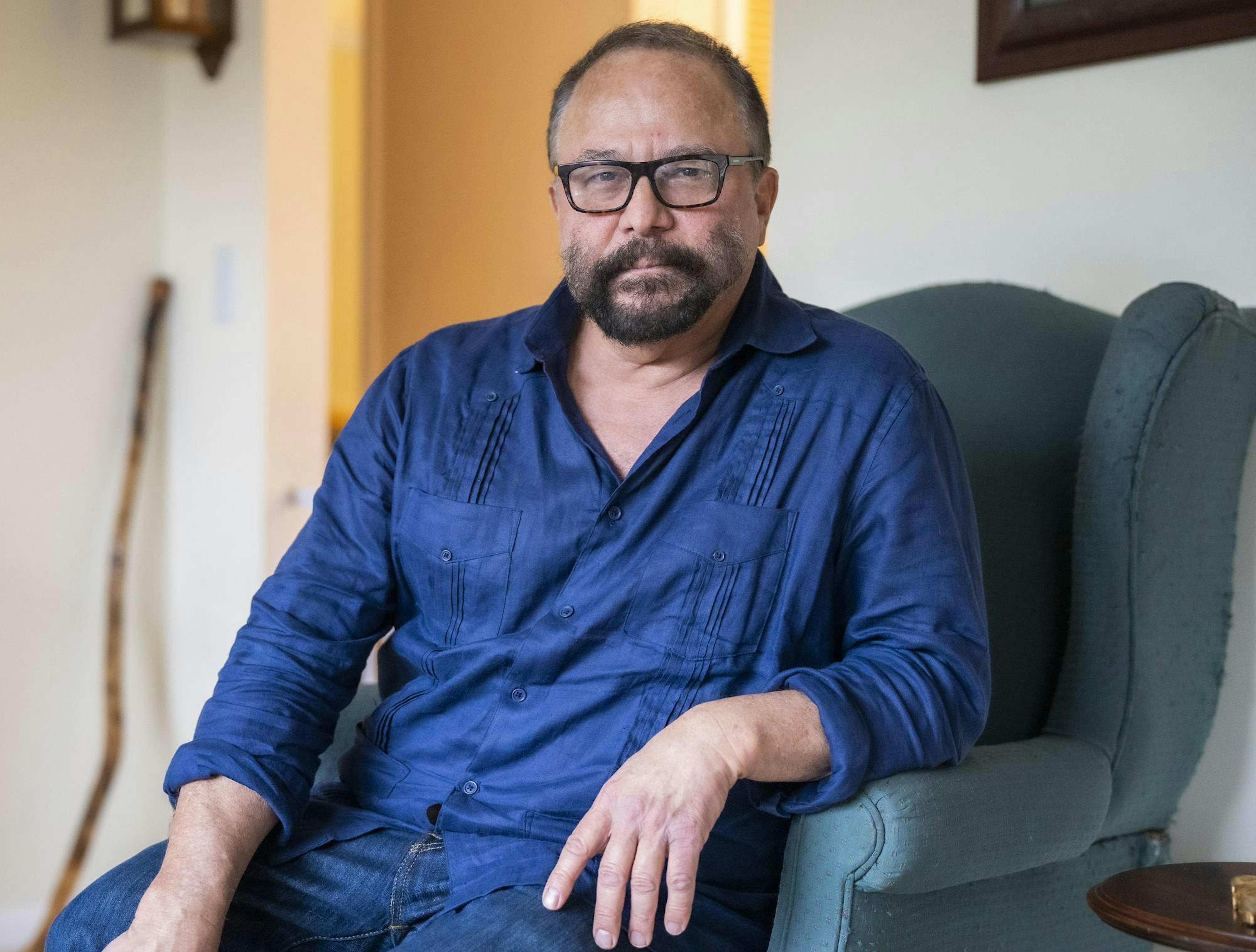 Assistant professor Marco Díaz-Muñoz sits in his living room, his personal “retreat” that, after the shooting, hosted reporters from across the country as he retold his experience in hopes of spurring change. “I felt like I was on display,” he said, but felt he couldn’t miss his opportunity to address the country while he had it. April 16, 2023. 