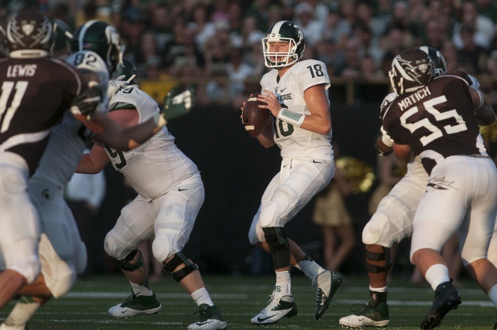 <p>Senior quarterback Connor Cook looks to pass on Sept. 4, 2015, during a game against Western Michigan at Waldo Stadium in Kalamazoo, Mich. The Spartans beat the Broncos, 37-24. Julia Nagy/The State News</p>
