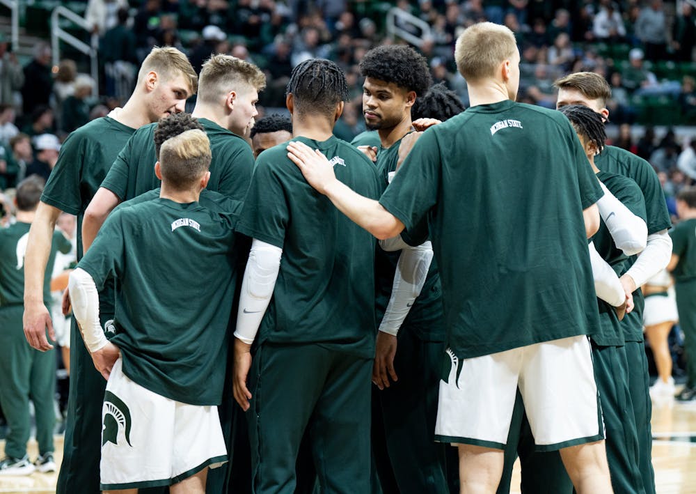 The MSU men's basketball team huddle up before second half during a game against Villanova at the Breslin Center on Nov. 18, 2022. The Spartans defeated the Wildcats 73-71. 