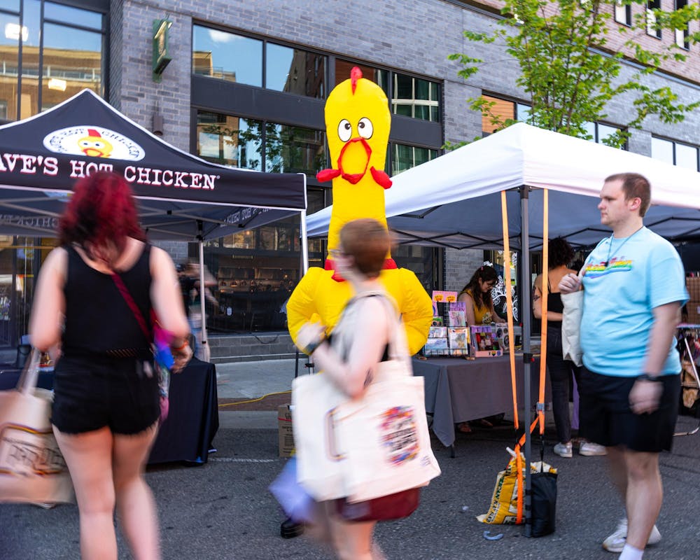 <p>The Dave's Hot Chicken booth at East Lansing Pride presents a "drag chicken" on Albert Ave in East Lansing, Mich., on June 13, 2026.</p>