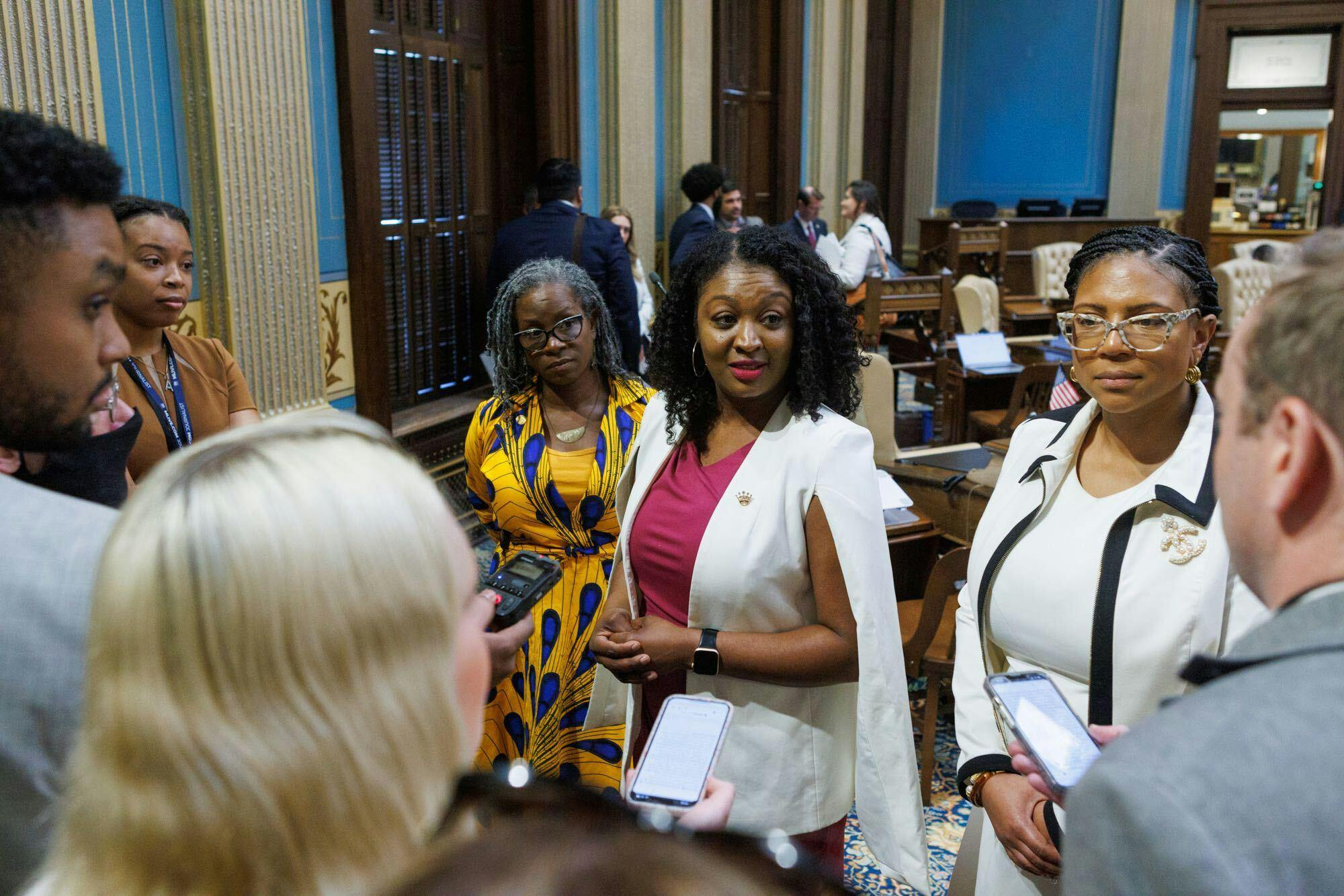 State Sen. Sarah Anthony (D-Lansing) joins colleagues on the House floor to celebrate the passage of the CROWN Act on June 8. Anthony was the sponsor of the bill after first introducing it in 2019. 