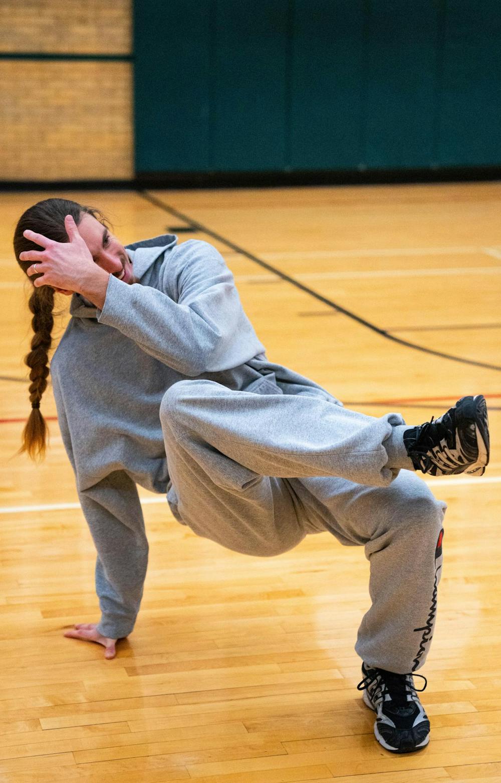 Tabor Vitz, breakdance alum, demonstrates a move at IM Circle in East Lansing on Dec. 2nd, 2025.
