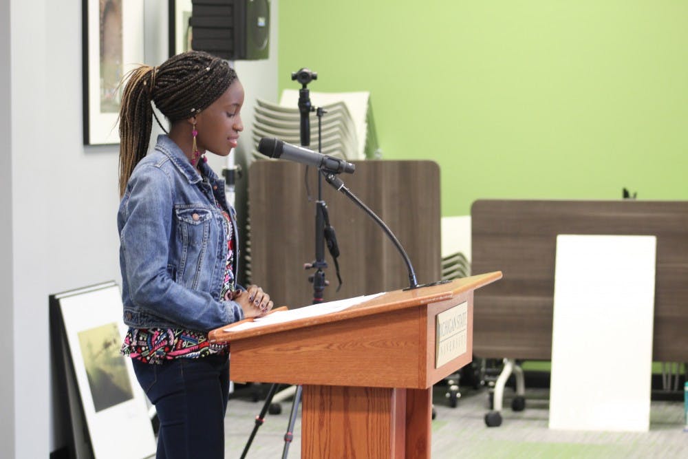 Psychology sophomore Natalie Kagole, an international student from Uganda, reads her essay “To Be a Spartan. To Be Empowered." Her essay won first prize in a contest held by OISS. 