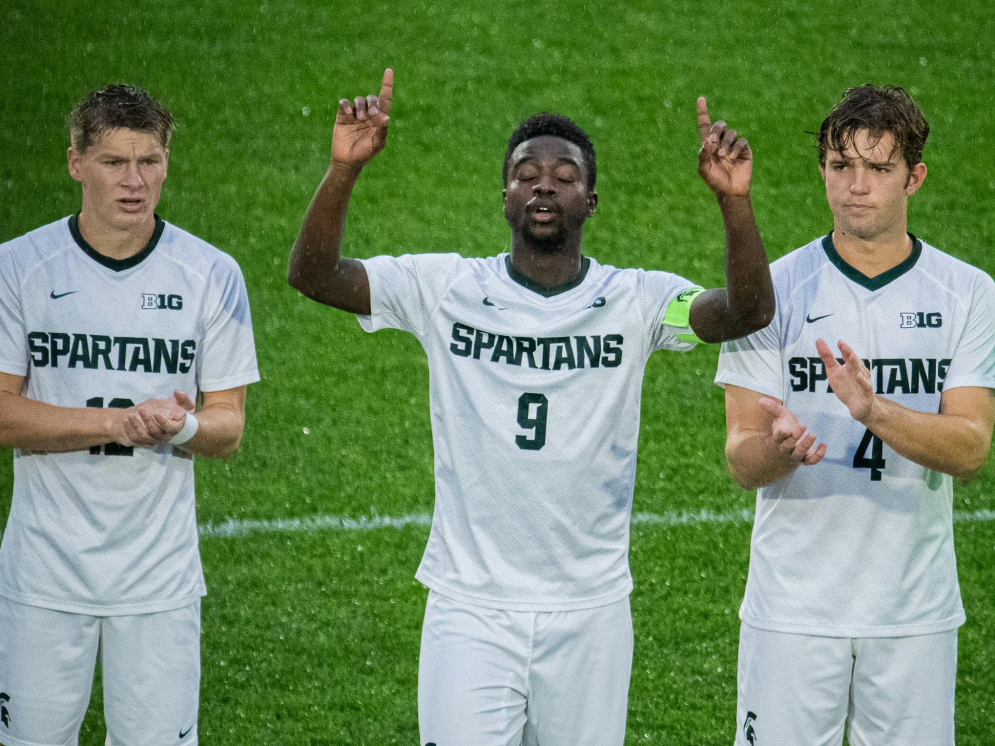 <p>Senior forward Farai Mutatu points to the sky during his pre-game ritual on Sept. 21, 2021.</p>