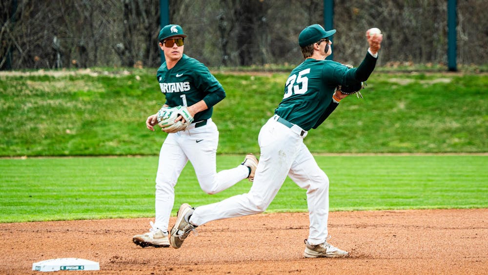 MSU sophomore infielder Ryan McKay (1) watches junior infielder Randy Seymour (35) turn a double play during a game at McLane Stadium on April 13, 2025.
