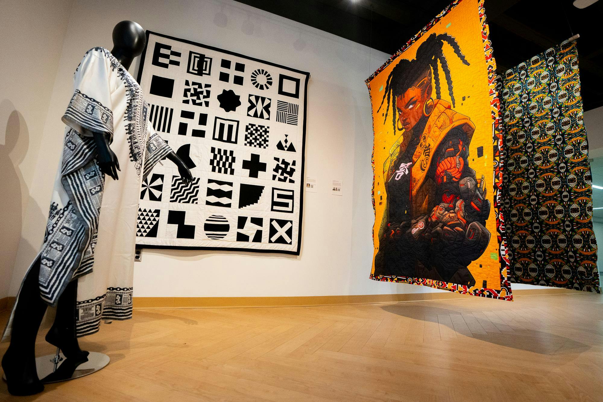Quiltmakers and quilt scholars' work on display for the Afrofuturism & Quilts exhibit at the MSU Union on May 17, 2024. Each piece in the exhibition highlights different aspects of the quiltmakers' identities.