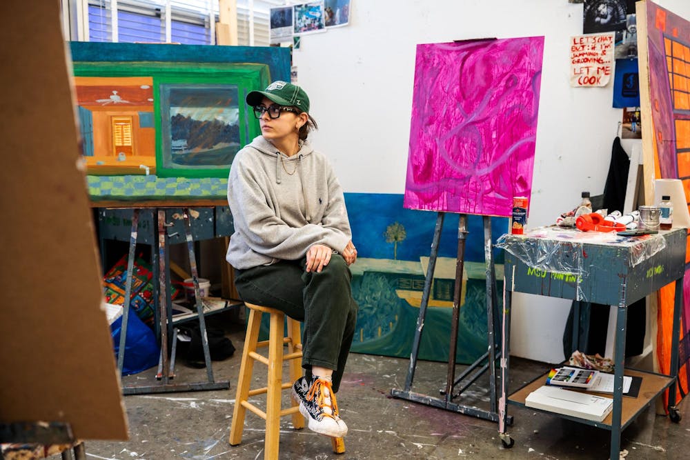 Fourth-year Michigan State studio art student Evan Yalowitz poses in her studio within the Kresge Art Center on April 4, 2025. The Kresge Art Center, located on Auditorium Road, serves as the home for the Department of Art, Art History, and Design, providing dedicated studio spaces for students to develop their artistic practices 