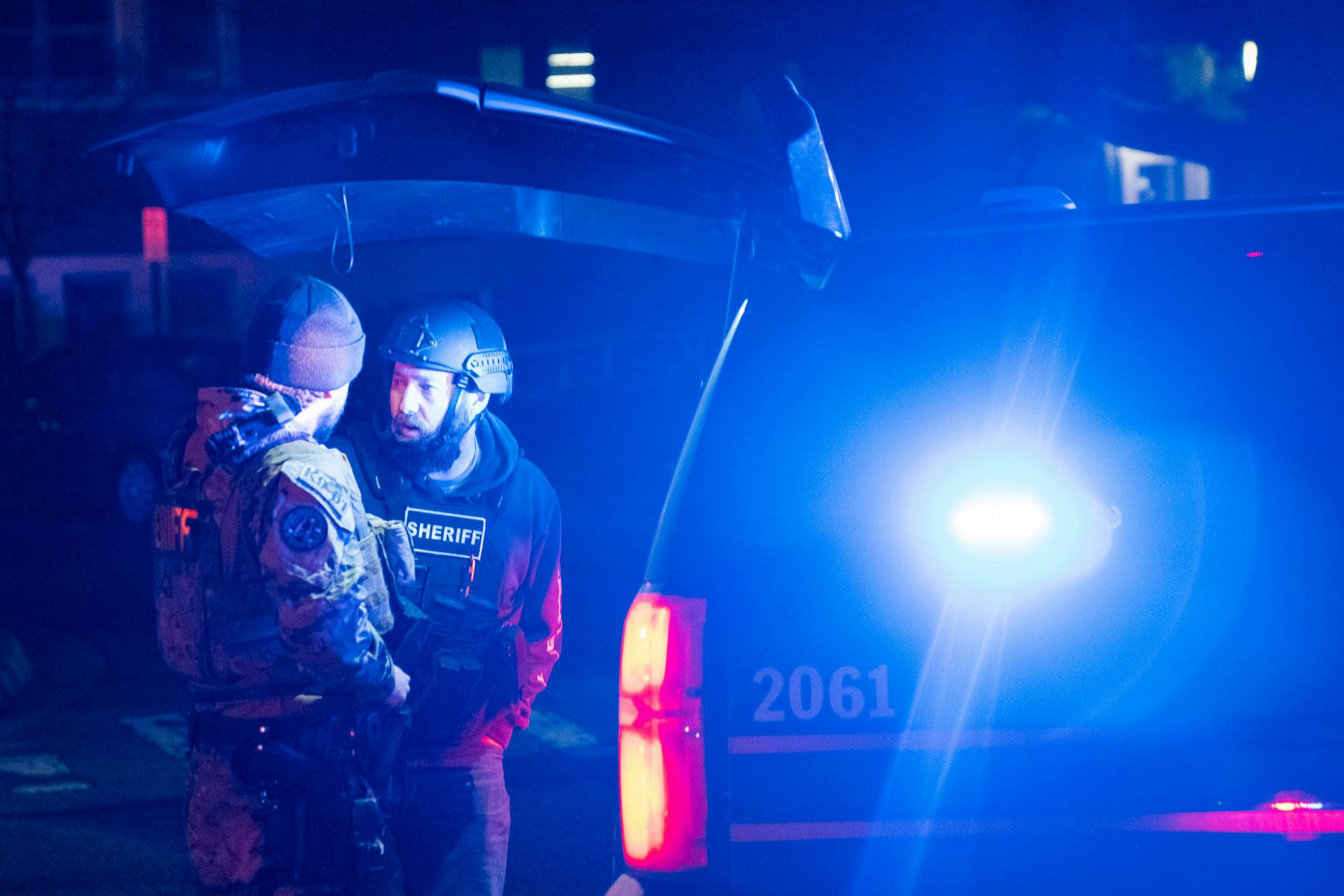 <p>Police officers talk outside of MSU Union as they dress in tactical gear during the response of a shooting on Michigan State’s campus on the night Feb. 13, 2023.</p>