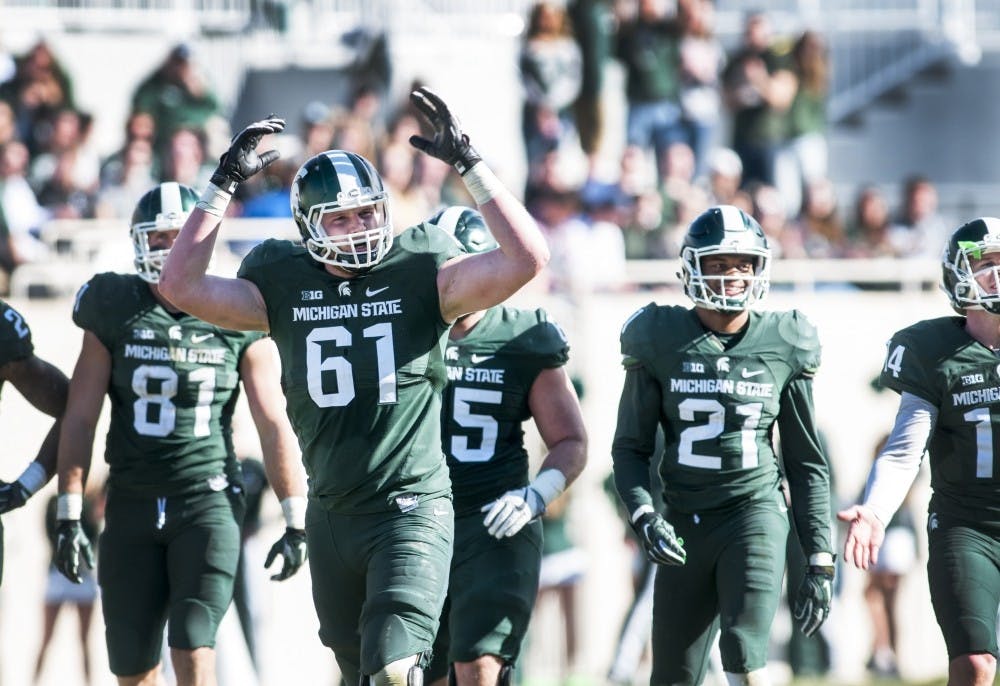 Junior offensive tackle Cole Chewins (61) expresses emotion during the Green and White Spring Game on April 1, 2017 at Spartan Stadium. The White team defeated the Green team, 33-23.