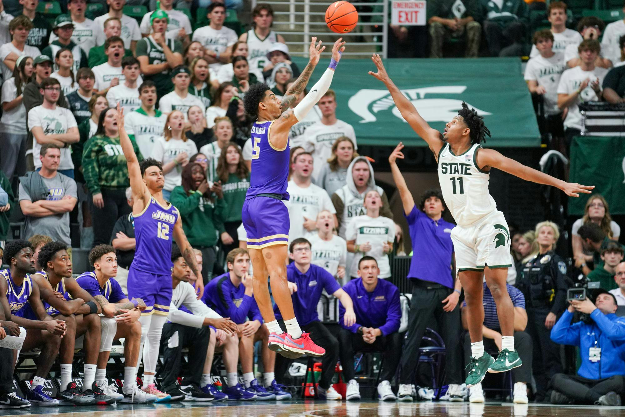 <p>Senior guard A.J. Hoggard (11) defending a 3-point shot from junior guard Terrence Edwards Jr. (5) during a game between Michigan State and James Madison University at the Breslin Student Events Center on Nov. 6, 2023. Edwards scored 24 points in the game with two 3-pointers made.</p>