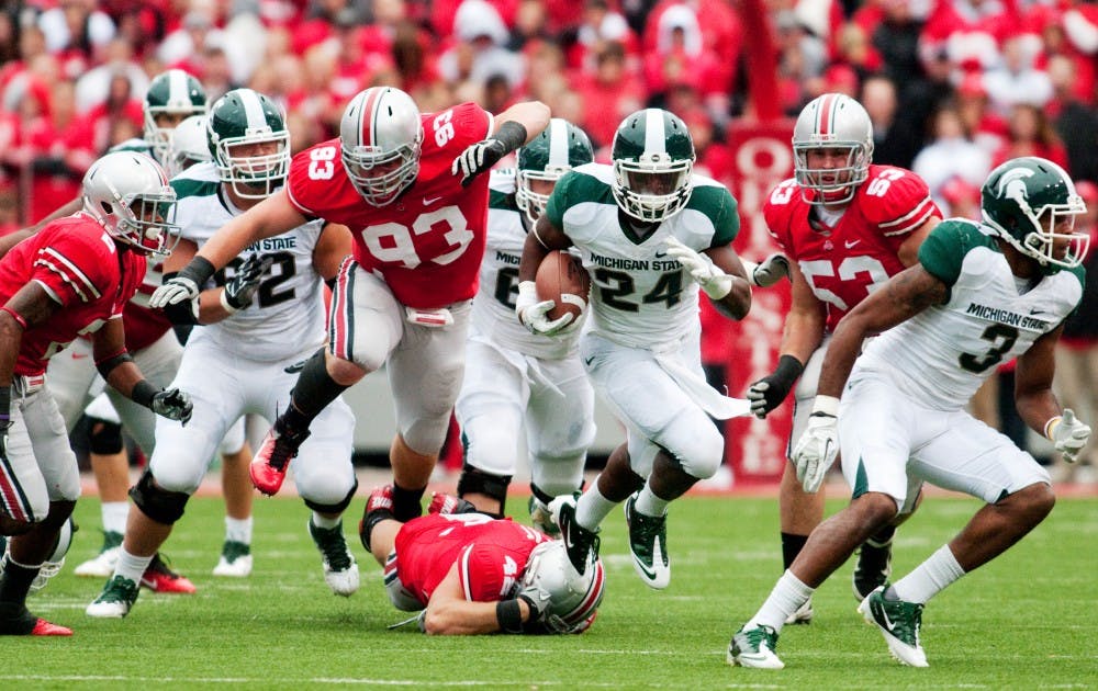 Sophomore running back Le'Veon Bell breaks a tackle and finds a running lane in the Ohio State defense. The Spartans defeated Ohio State, 10-7, for the first time since 1999 on Saturday afternoon at Ohio Stadium in Columbus, Ohio. Josh Radtke/The State News