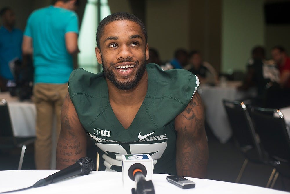 <p>Senior safety Kurtis Drummond talks to the media during Football Media Day at the Huntington Club of Spartan Stadium. Coming off of a 13-1 season and a Rose Bowl victory, the Spartans are due to kick off the season Aug. 29. Danyelle Morrow/The State News</p>