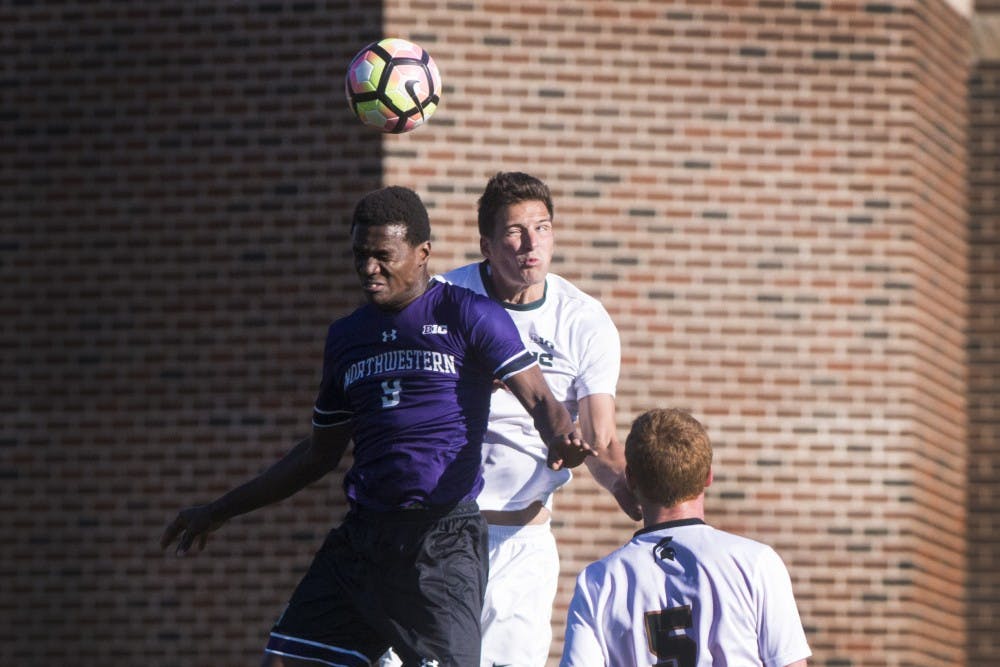 Junior defender Jimmy Fiscus (3) and Northwestern forward Elo Ozumba (9) head the ball during the game against Northwestern on Oct. 22, 2016 at DeMartin Stadium at Old College Field. The Spartans defeated the Wildcats, 2-1.