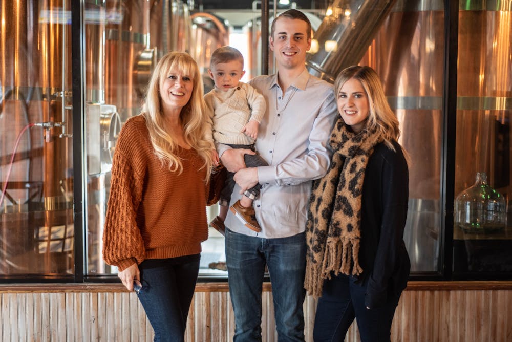 Left to right, Harper’s owner Trisha Riley poses with grandchild Weston Crouch, 2, son Harper Riley and daughter Chanelle Crouch at Harper's Restaurant & Brew Pub on Feb. 5, 2019.