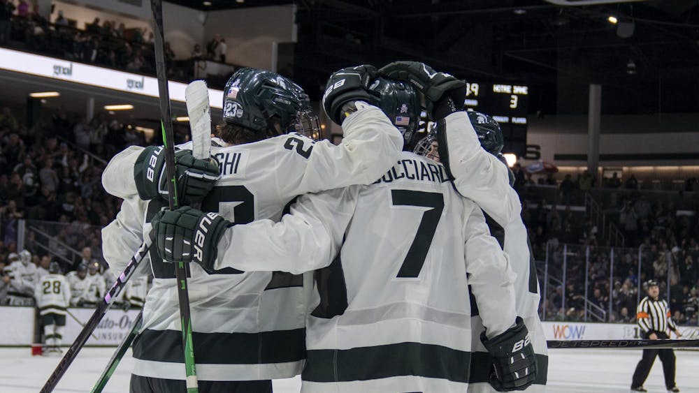<p>MSU players celebrate their 7th goal against Notre Dame at Munn Ice Arena on Nov. 15, 2024. Michigan State took the win 8-3.</p>