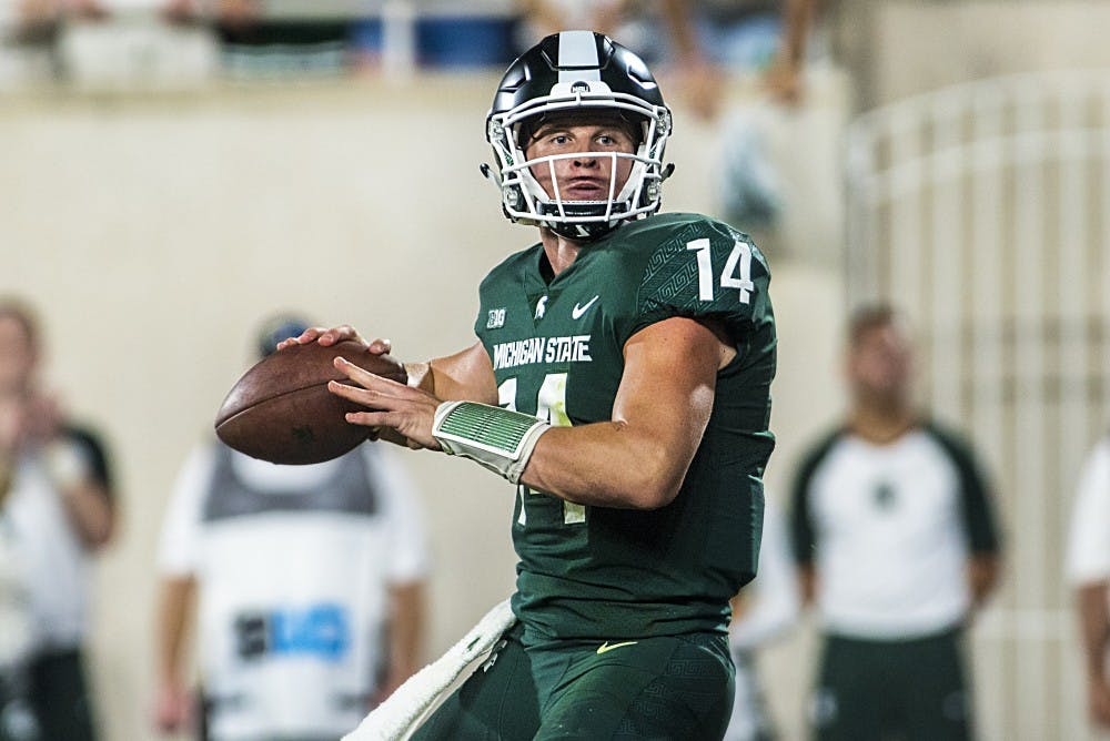 Sophomore quarterback Brian Lewerke (14) looks to throw the ball during the game against Notre Dame on Sept. 23, 2017 at Spartan Stadium. The Spartans fell to the Fighting Irish, 38-18. 