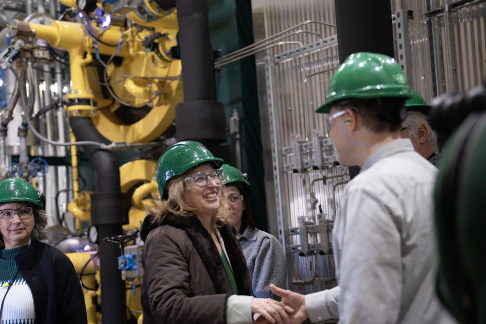 <p>Interim-President Teresa Woodruff meets the staff of MSU's Simon Power Plant at a media event on March 20th, 2023.</p>