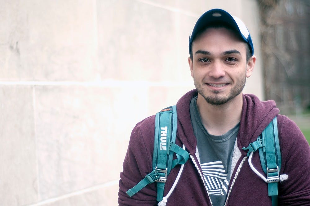 <p>Economics sophomore Lucas Keomany poses for a portrait April 13, 2015, outside the MSU Union. Keomany said he used to work in underwater welding but retired because of the dangers of the job. Kelsey Feldpausch/ The State News</p>