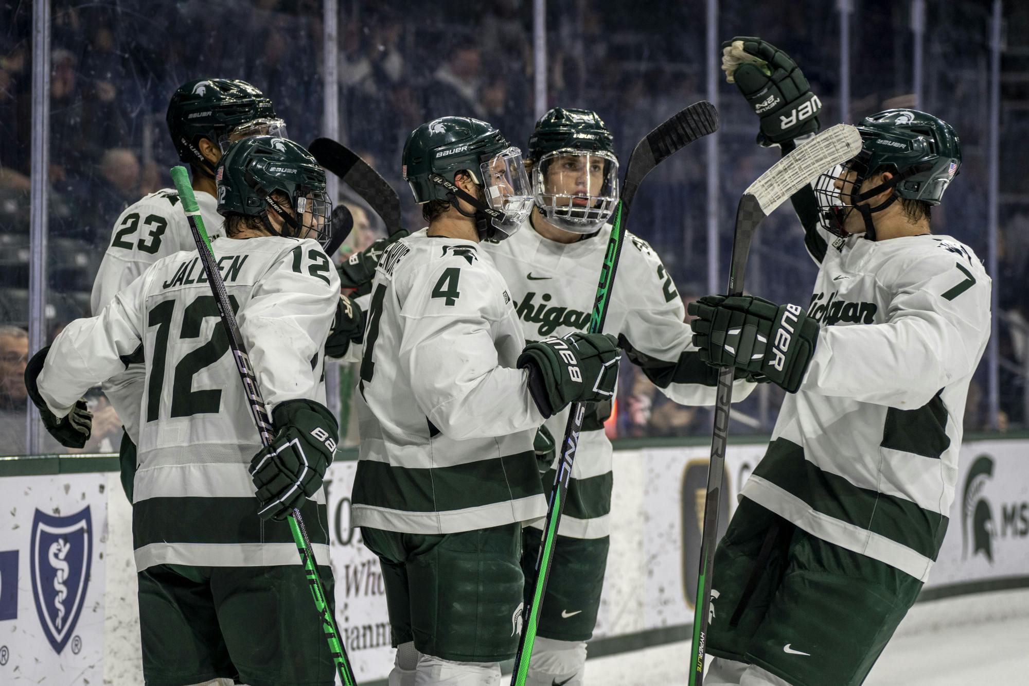 <p>Spartans celebrate a goal during a game of hockey between MSU and Long Island University at Munn Ice Arena in East Lansing on Oct. 21, 2022. The Spartans won, 3-1.</p>